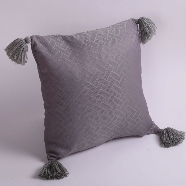 pillow with yarn tassels