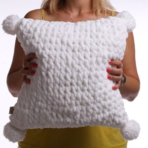 white fluffy pom pom pillow