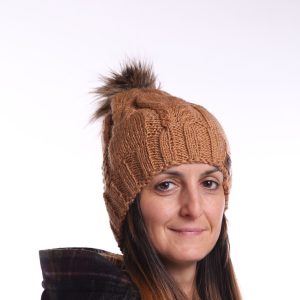 brown knit hat with pom pom